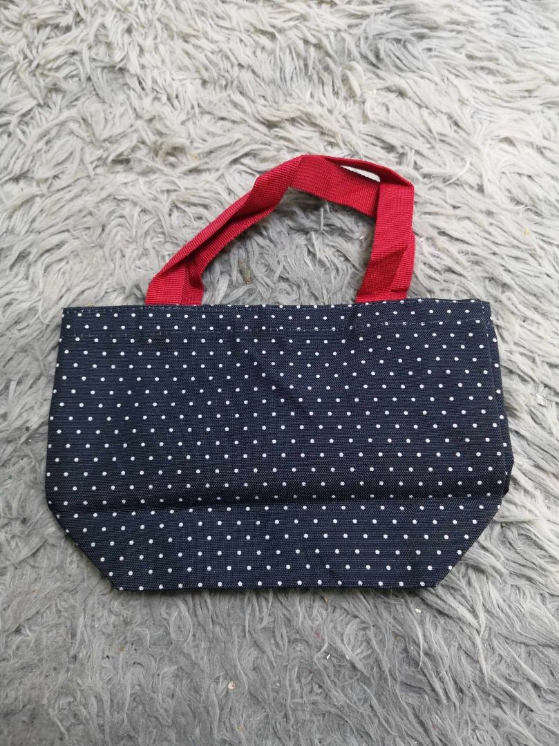 Blue & Red Polka Dotted Tote Bag (Category: Tote Bags) located in Santa Cruz. Submitted by jmy_surplus.2 (Listing ID 1463245886, Image 1). Description: Size ; L - 6.4 W - 9.6 Color ; Navy Blue Type ; Tote Bag Brand ; No brand Material ; Nylon Style ; Navy Blue Polka Dotted pattern Tote bag LR 129 JMY 4 Batch #223.