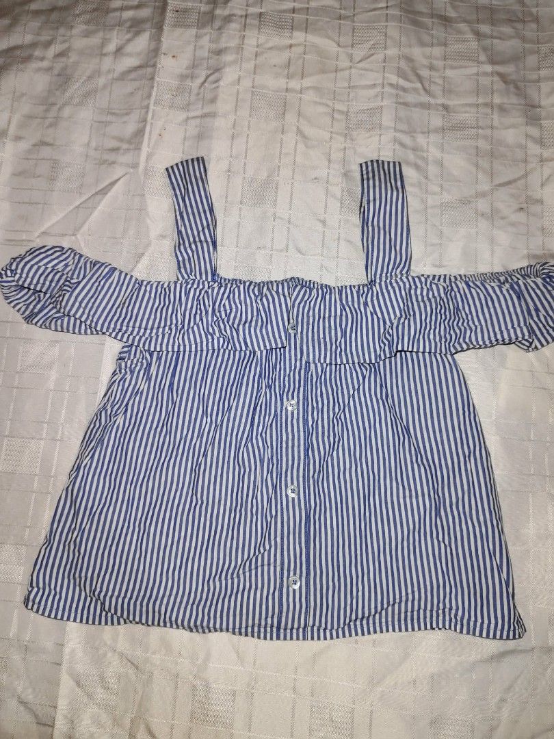 Blue and White Striped Cold Shoulder Top (Category: Blouses) located in Manila. Submitted by ck.key (Listing ID 1463207687, Image 1). Description: Cute blue and white striped cold shoulder top with ruffled sleeves and front buttons. Perfect for casual outings or beach trips. Pairs well with jeans or shorts. s:s-m.