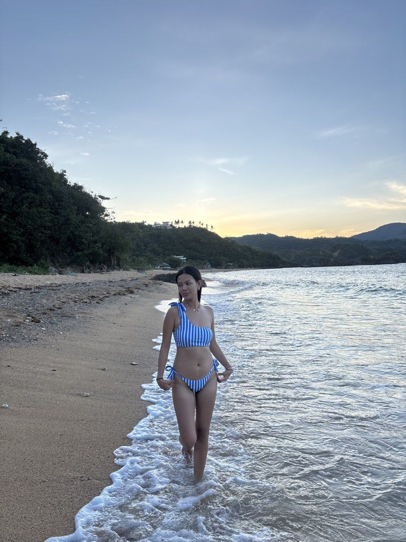 Blue and White Striped One-Shoulder Bikini (Category: Bikinis & Swimsuits) located in Polangui. Submitted by zrhmendoza34061 (Listing ID 1463293020, Image 3). Description: Used once - Adorable blue and white striped bikini - Trendy one-shoulder top with tie details - Matching bottoms with adjustable tie sides - Ideal for beach days and pool parties - Comfortable, stylish, and vacation-ready.