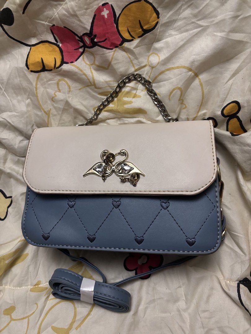 blue mini bag (Category: Purses & Pouches) located in Taguig. Submitted by megdeclutterz (Listing ID 1463258808, Image 3). Description: - small bag - not branded - with strap - approx. 6x8 inches - working zippers ‼️ negotiable ‼️ please manage your expectations ‼️ Taguig/Bgc location.