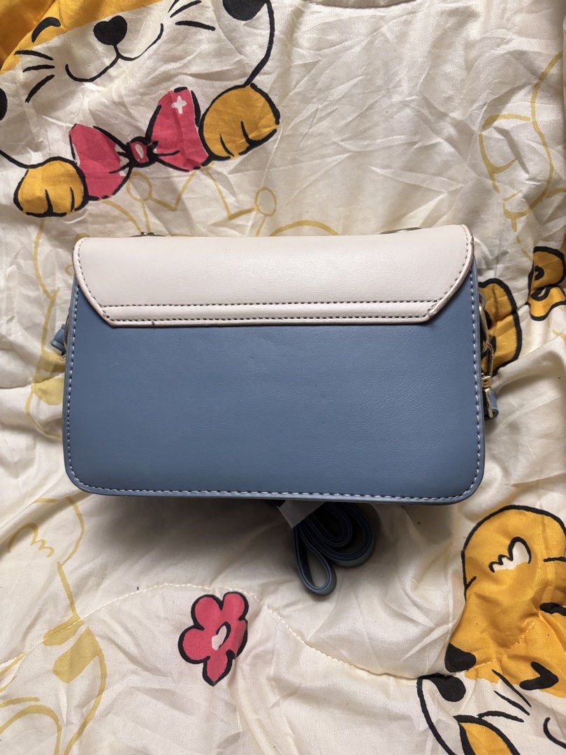 blue mini bag (Category: Purses & Pouches) located in Taguig. Submitted by megdeclutterz (Listing ID 1463258808, Image 2). Description: - small bag - not branded - with strap - approx. 6x8 inches - working zippers ‼️ negotiable ‼️ please manage your expectations ‼️ Taguig/Bgc location.