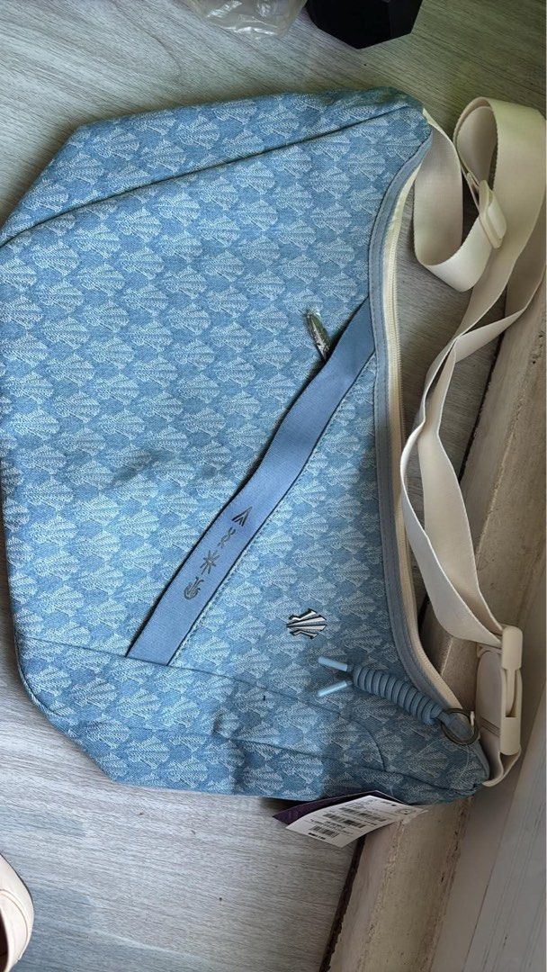 Blue patterned sling bag with adjustable strap (Category: Sling Bags) located in Quezon City. Submitted by albertojay09 (Listing ID 1463193870, Image 1). Description: - Stylish cool blue sling bag with a unique all-over pattern. - Main zippered compartment for secure storage. - Convenient outer pocket with a flap closure. - Adjustable strap with a buckle for a customized fit. - Ideal for everyday wear and casual outings. - anta kai bag unreleased