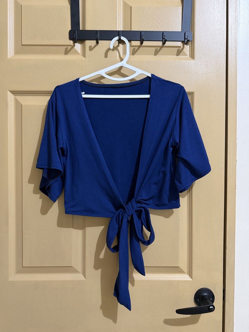 Blue Tie-Front Cropped Cardigan (Category: Coats, Jackets and Outerwear) located in Manila. Submitted by chavirly (Listing ID 1463267093, Image 1). Description: - Adorable blue cropped cardigan - Features a stylish tie-front closure - Short, flowy sleeves for a breezy feel - Made from soft and stretchy material - Versatile for casual or dressy layering over tops and dresses.