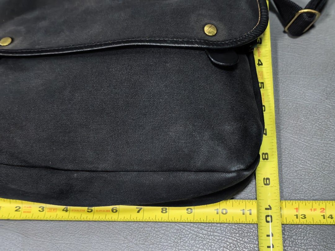 Brady Black Canvas Leather Trim Messenger Bag (Category: Sling Bags) located in Cagayan de Oro. Submitted by pootx (Listing ID 1463269741, Image 2). Description: - Brand: Brady - Style: Messenger Bag - Material: Black Canvas with Leather Trim - Hardware: Brass - Interior: Lined with a pocket - Strap: Adjustable for comfort - Dimensions: Approx. 12 inches wide x 9 inches tall - Ideal for: Everyday use, travel.