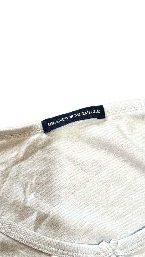 Authentic Brandy Melville White Henley Top (Category: Shirts) located in Manila. Submitted by retrocancer (Listing ID 1463220025, Image 2). Description: size small-medium no issue.
