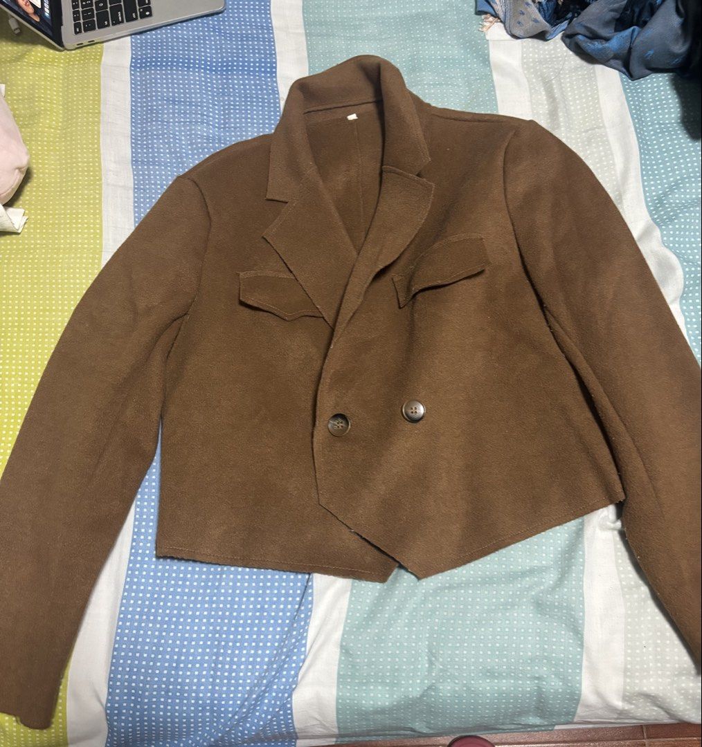 Brown Cropped Jacket/Blazer (Category: Coats, Jackets and Outerwear) located in Quezon City. Submitted by engr36 (Listing ID 1463268213, Image 1). Description: - Brown cropped blazer - Double-breasted with two buttons - Two front flap pockets - Soft, comfortable material - Versatile for layering over tops, dresses, jeans, or skirts - bought in Hong Kong - fits small/petite but tag says L.