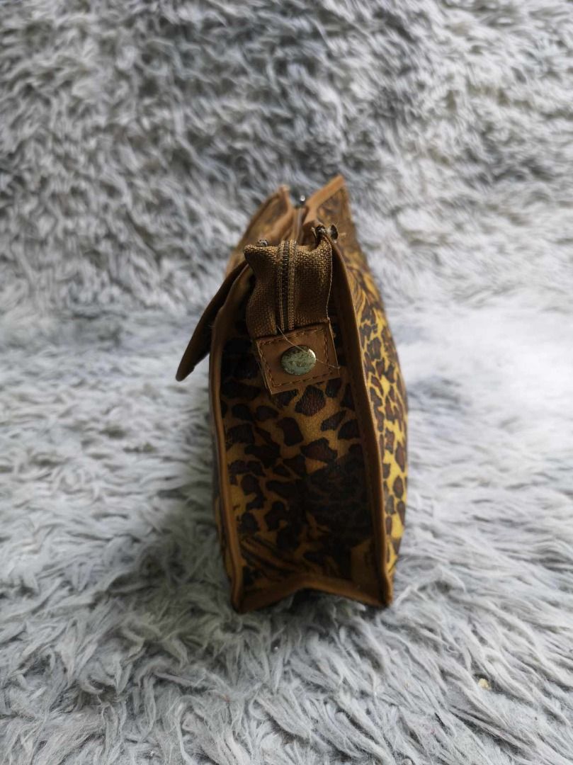 Brown leopard Print Cosmetic Pouch (Category: Purses & Pouches) located in Santa Cruz. Submitted by jmy_surplus.2 (Listing ID 1463127583, Image 3). Description: Size ; L- 7.3 W - 10 Color ; Brown Type ; Pouch Brand ; No brand Material ; Synthetic Style ; Brown leopard Print Pouch LR 129 JMY 4 Batch #223.