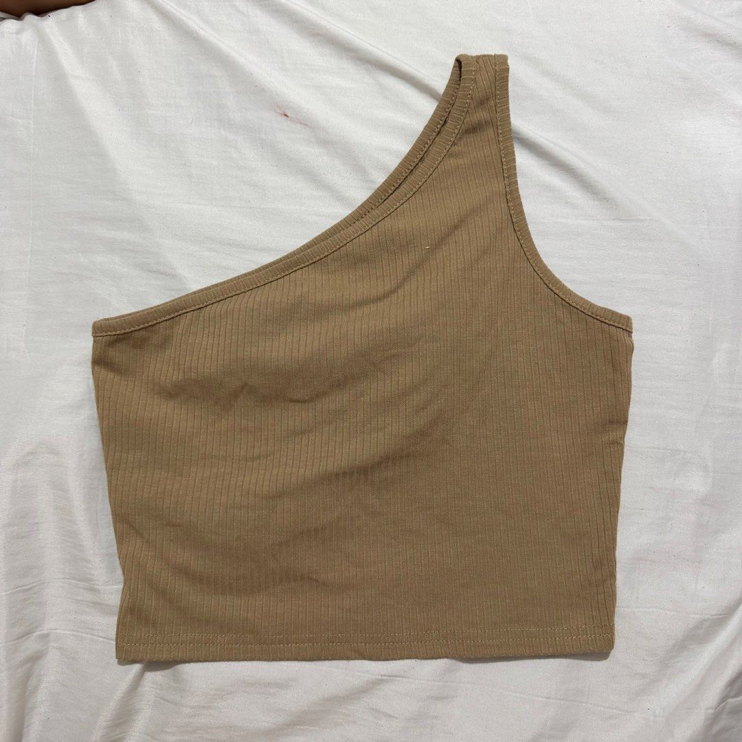 Brown One Shoulder Ribbed Crop Top (Category: Sleeveless) located in Manila. Submitted by bexxyah (Listing ID 1463262879, Image 1). Description: - Trendy brown ribbed crop top - Chic one-shoulder design - Comfortable stretchy material - Perfect for casual outings or dressing up - Effortlessly pairs with jeans or skirts.