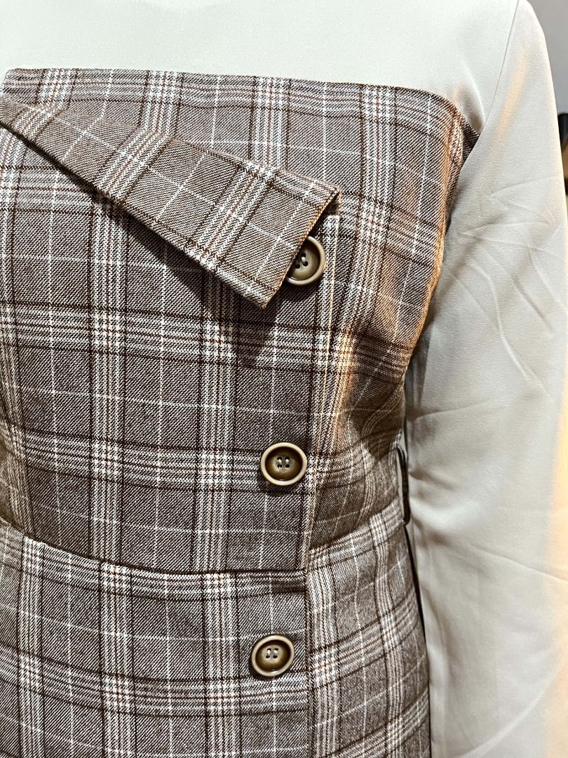 Brown Plaid Dress with Button Detail (Category: Dresses) located in Quezon City. Submitted by bunniezen (Listing ID 1463219396, Image 2). Description: - Classic brown plaid pattern - Contrasting cream top and sleeves - Versatile and stylish for any occasion.