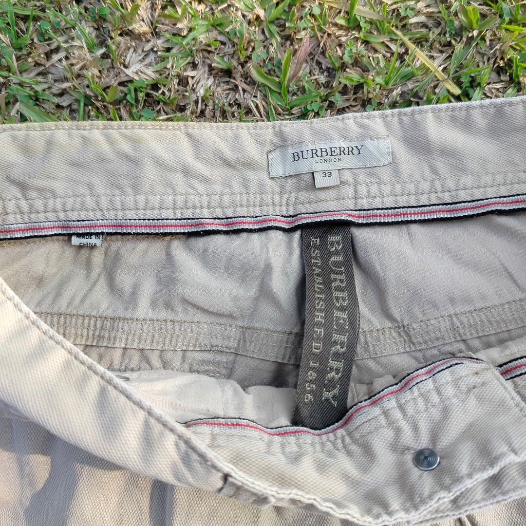 Burberry 2000s Embroidered Twill Shorts (Category: Coats, Jackets and Outerwear) located in Alabel. Submitted by gee.7thstreetz (Listing ID 1463163678, Image 3). Description: Mid - 2000s Burberry London cotton twill shorts with embossed leather knight patch. issue front botton L: 20 W: 15.5 LEG OPENING: 10.