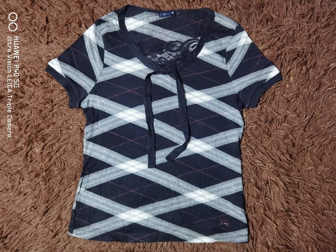 Burberry London Tshirt (Category: Shirts) located in Manila. Submitted by reddvelasquez.2 (Listing ID 1463127922, Image 1). Description: Burberry London Tshirt Size 2 on tag Fits XS-S 15.5 Width 22 Length Like New Condition No issues 800 pesos PM.