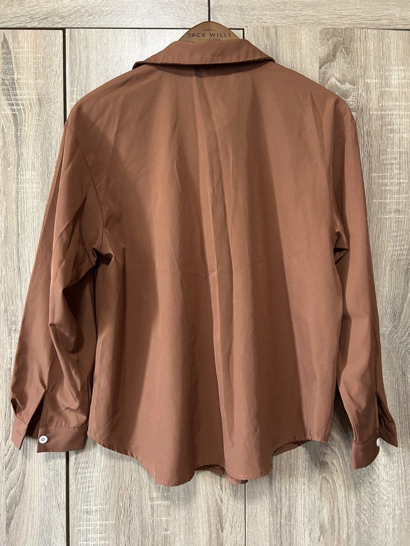 Button down shirt (Category: Shirts) located in Bulacan. Submitted by relove.re (Listing ID 1463248334, Image 2). Description: - camel brown button down shirt - soft - fit S to M - Classic and versatile design - with white buttons - stylis, perfect for office use or casual night outs - quality as good as new /no flaws.