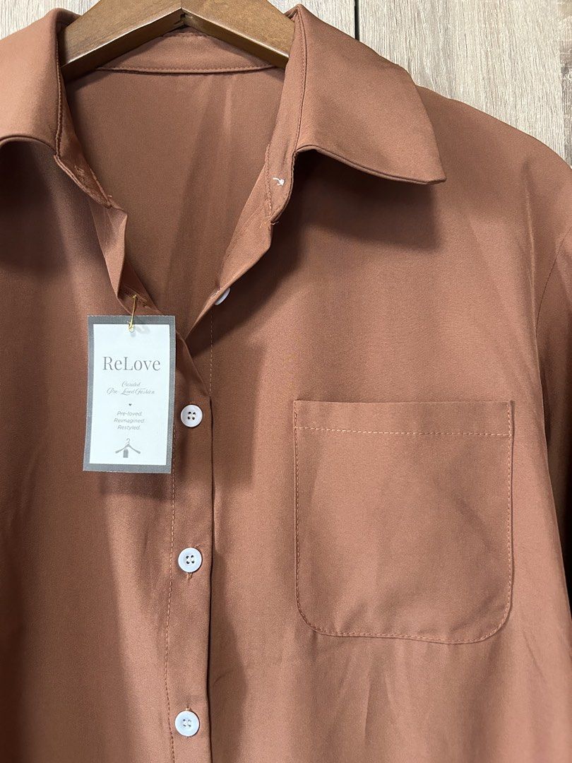 Button down shirt (Category: Shirts) located in Bulacan. Submitted by relove.re (Listing ID 1463248334, Image 3). Description: - camel brown button down shirt - soft - fit S to M - Classic and versatile design - with white buttons - stylis, perfect for office use or casual night outs - quality as good as new /no flaws.