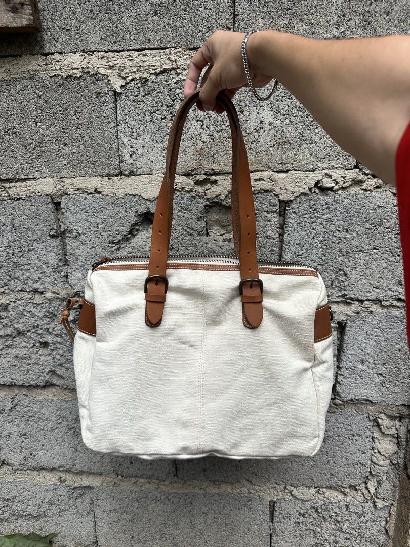 Cachellie Canvass leather trimmed tote bag. (Category: Tote Bags) located in Cagayan de Oro. Submitted by kjcartier26 (Listing ID 1463262299, Image 2). Description: ~ In good condition . ~ Flawlessly beautiful . - Genuine leather trimmed. ~ Adjustable strap, Comes with cross-Body strap. ~ Minimal washable stains due to Poor storage..