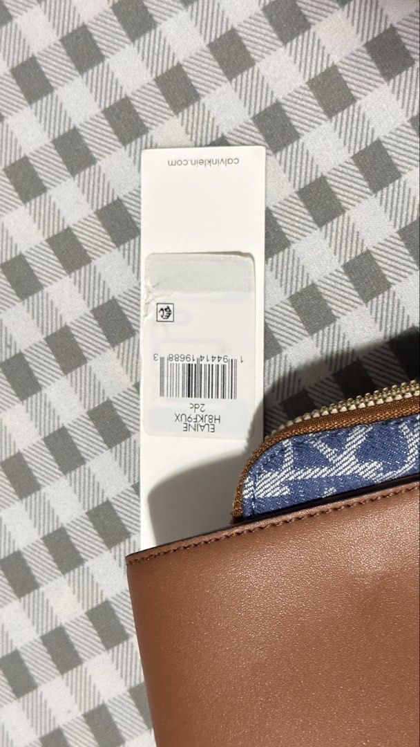 Calvin Klein Elaine Denim Monogram Shoulder Bag (Category: Luxury Bags & Wallets) located in Caloocan City. Submitted by stephgxr (Listing ID 1463226523, Image 2). Description: ₱1,200 negotiable - Chic Calvin Klein monogram denim shoulder bag - Elegant brown leather accents - Secure zippered main compartment - Convenient front flap pocket - Interior organization: multiple card slots and a zippered pocket - Comes with original tag.