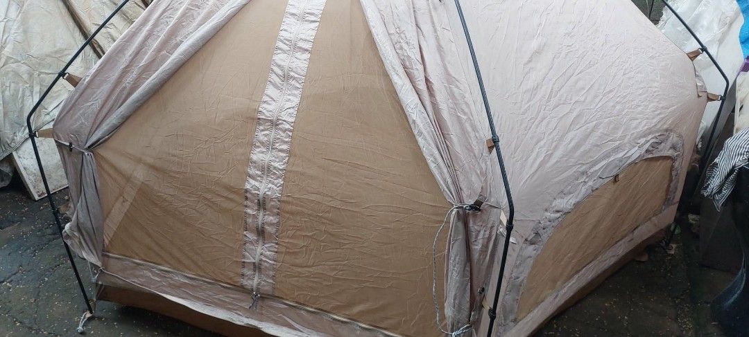 Camping Tent with Poles and Bag (Category: Hiking & Camping) located in Valenzuela. Submitted by newbear.425b6e (Listing ID 1463272481, Image 1). Description: - Tan camping tent - Includes poles and carrying bag - Mesh inner layer for ventilation - Some dust/dirt from storage - Perfect for your next outdoor adventure.
