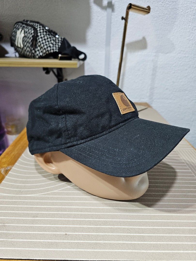 Carhartt cotton baseball cap (Category: Caps & Hats) located in Baguio. Submitted by kayeonlineshop (Listing ID 1463184544, Image 3). Description: -black Carhartt cotton baseball cap featuring a distinctive square tan leather logo patch on the front..