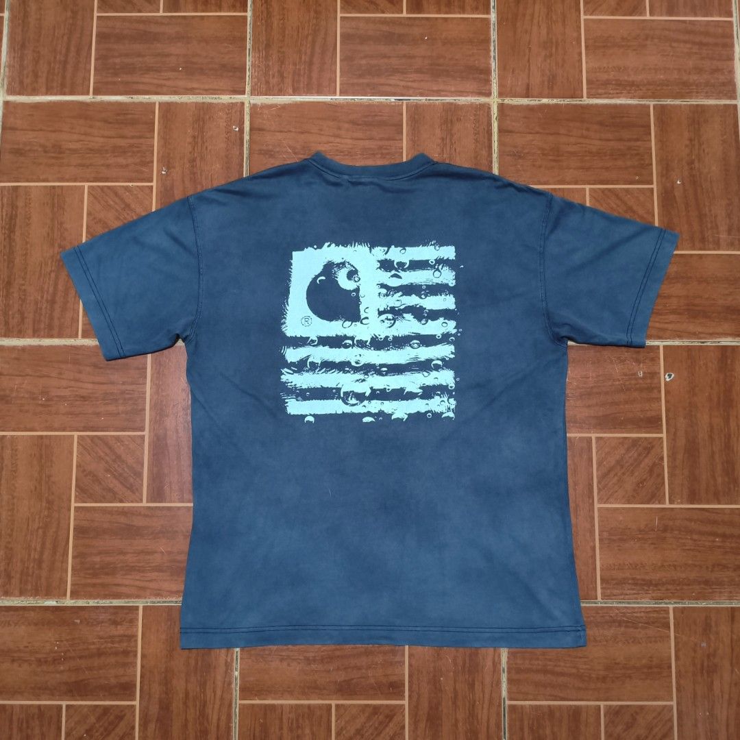 Carhartt WIP T-Shirt Size - Chromo (Category: Tshirts & Polo Shirts ) located in Baguio. Submitted by hevimetl (Listing ID 1463192561, Image 2). Description: - Brand: Carhartt WIP - Color: Faded Blue/Teal - Design: Classic Carhartt logo on front, graphic print on back - Material: 100% Organic Cotton - Size: Tagged L - Best for: Casual wear.