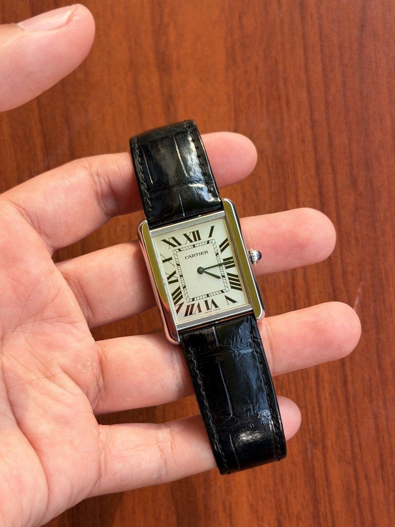 Cartier Tank Solo Large (Category: Luxury Watches) located in Quezon City. Submitted by lucas_luxuries (Listing ID 1463298619, Image 2). Description: For sale! Cartier Tank Solo Large ₱170,000 only • Condition: 9/10 • Inclusions: Box, Cartier pouch, Cartier service paper • High-autonomy Cartier Quartz • 34.8mm case diameter and 5.5mm case thickness • Clear silvered opaline dial with black Roman numeral markers • Signature Blued-steel sword-shaped