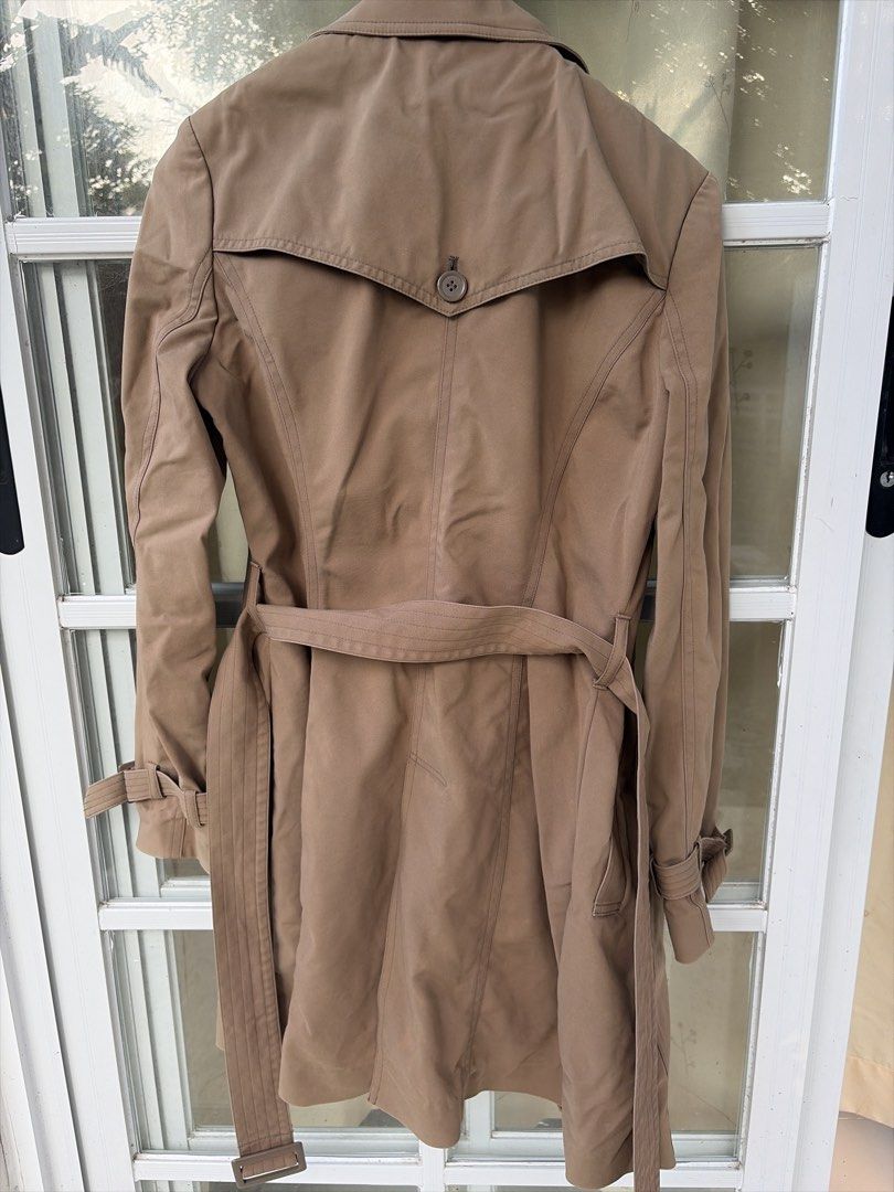 Cecil McBee Double Breasted Trench Coat (Category: Coats, Jackets and Outerwear) located in Bulacan. Submitted by aarchive (Listing ID 1463322826, Image 3). Description: - Classic Cecil McBee trench coat - Double-breasted style - Includes a belt to cinch the waist - Button details on front and cuffs - Features a back storm flap - Ideal for layering over any outfit - A timeless addition to your wardrobe -Stitchings on the buttons are slightly loos