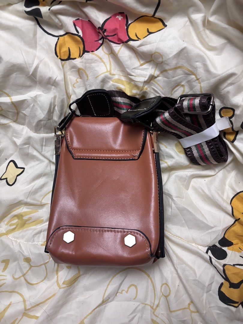 Cellphone bag (Category: Purses & Pouches) located in Taguig. Submitted by megdeclutterz (Listing ID 1463257231, Image 2). Description: - small bag - not branded - with strap - approx. 4x6 inches - no zippers ‼️ negotiable ‼️ please manage your expectations ‼️ Taguig/Bgc location.
