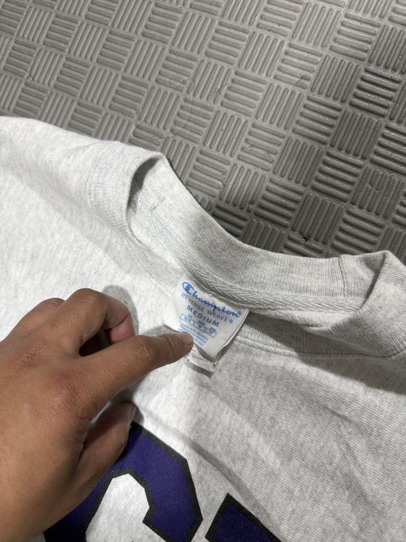 Champion TCU Reverse Weave Crewneck Sweatshirt Medium (Category: Coats, Jackets and Outerwear) located in Baguio. Submitted by MysticVaultPh (Listing ID 1463291633, Image 3). Description: - Grey Champion Reverse Weave sweatshirt - Features large navy blue 'TCU' graphic on the front - Classic crewneck style with long sleeves - Small Champion 'C' logo on the left sleeve cuff - Ideal for TCU fans or casual wear.