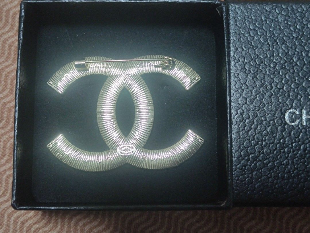 Chanel CC Rhinestone Brooch with Box (Category: Brooches) located in Cainta. Submitted by luxesparkle (Listing ID 1463267430, Image 3). Description: - Authentic Chanel CC brooch - Adorned with sparkling rhinestones - Comes with Chanel box - Perfect accessory to elevate any outfit - Secure pin closure on the back - Made in Italy .