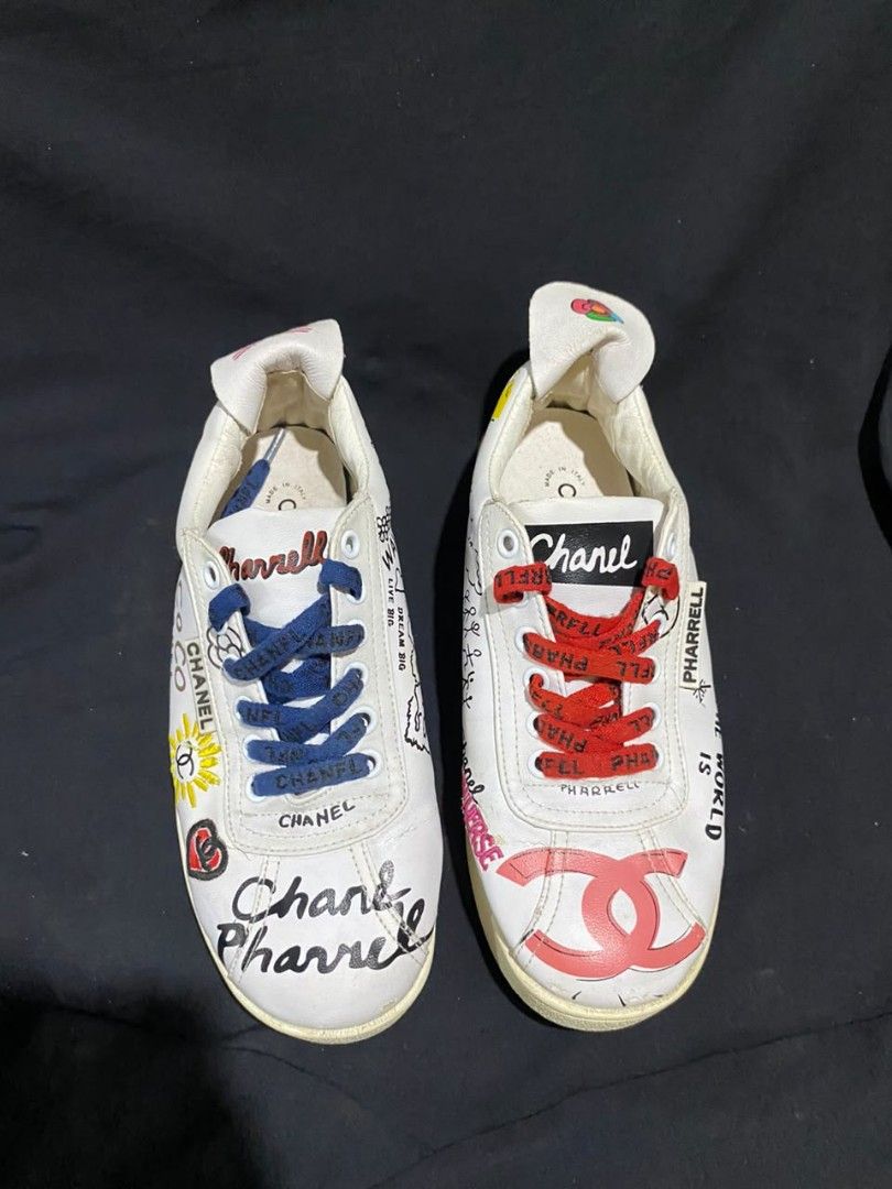 Chanel Collaboration with Pharrell Williams (Category: Sneakers & Footwear) located in Zamboanga. Submitted by rkrey (Listing ID 1463120285, Image 3). Description: limited-edition Chanel x Pharrell Williams White Multi-Color Graffiti Canvas Sneakers, featuring playful, hand-drawn multicolored lettering and embroidered CC logos across the upper US 8 Women's Euro 39 Slightly Negotiable Price.