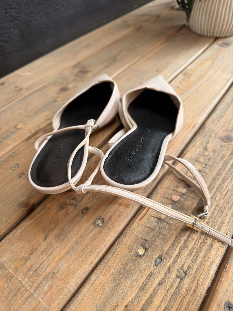 Charles & Keith Beige Pointed Toe Slingback Heels (Category: Heels) located in Tuguegarao City. Submitted by joysmithznjo (Listing ID 1463203299, Image 3). Description: - Brand: Charles & Keith - Color: Beige - Style: Pointed toe slingback heels - Features: Thin ankle strap with buckle closure, low heel - Versatility: Perfect for dressing up or down.