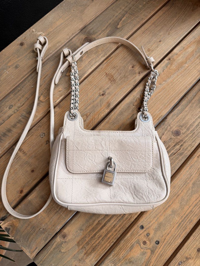 Charles & Keith Beige Quilted Chain Shoulder Bag with Lock (Category: Shoulder Bags) located in Tuguegarao City. Submitted by joysmithznjo (Listing ID 1463204476, Image 1). Description: - Beige shoulder bag from Charles & Keith - Features a quilted front flap with a cute lock detail - Stylish chain strap for an edgy touch - Interior compartments for easy organization - Versatile for everyday use or nights out.