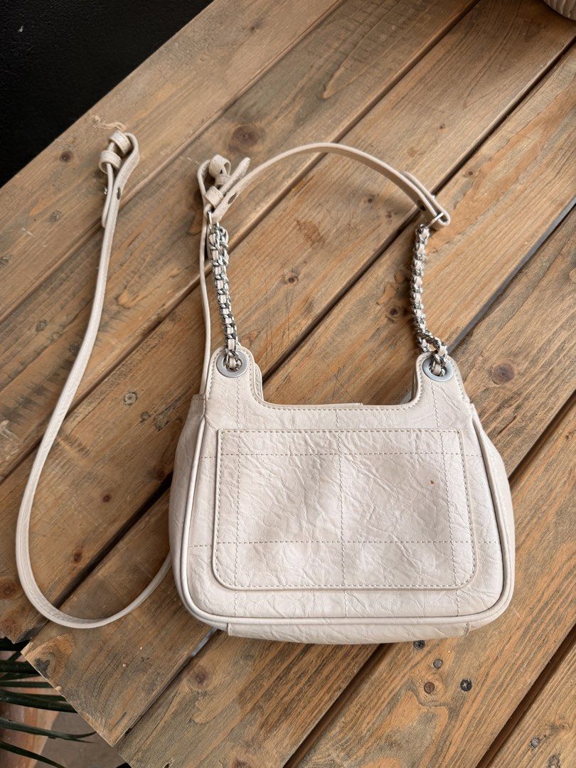 Charles & Keith Beige Quilted Chain Shoulder Bag with Lock (Category: Shoulder Bags) located in Tuguegarao City. Submitted by joysmithznjo (Listing ID 1463204476, Image 2). Description: - Beige shoulder bag from Charles & Keith - Features a quilted front flap with a cute lock detail - Stylish chain strap for an edgy touch - Interior compartments for easy organization - Versatile for everyday use or nights out.