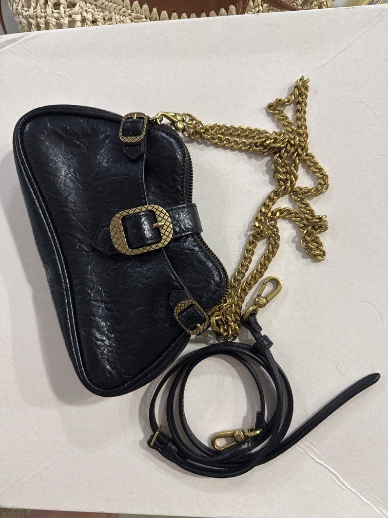 Charles & Keith black shoulder/crossbody bag (Category: Shoulder Bags) located in Taguig. Submitted by darjaromanova (Listing ID 1463183335, Image 1). Description: Black leather shoulder/crossbody bag with gold-tone chain details. • Black leather finish • Gold-tone hardware and chain strap • Comes with both chain and adjustable leather strap • Zipper closure • Classic design that goes with everything • Good pre-loved condition Please check the ph