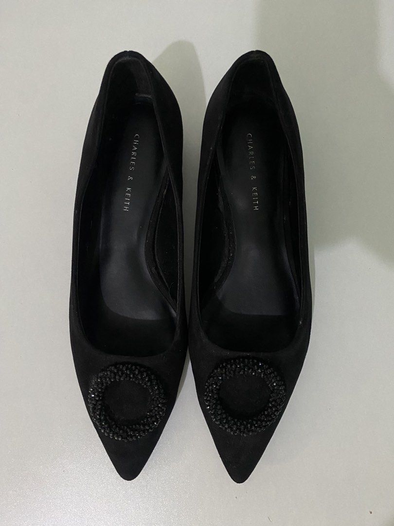 Charles & Keith Black Suede Embellished Heels (Category: Flats & Sandals) located in Manila. Submitted by wildocean-ff89 (Listing ID 1463206159, Image 2). Description: - Brand: Charles & Keith - Material: Black Suede - Style: Pointed-toe heels - Feature: Circular embellishment on the front - Heel Type: Low block heel - Closure: Slip-on - Versatile: Perfect for dressing up or down.