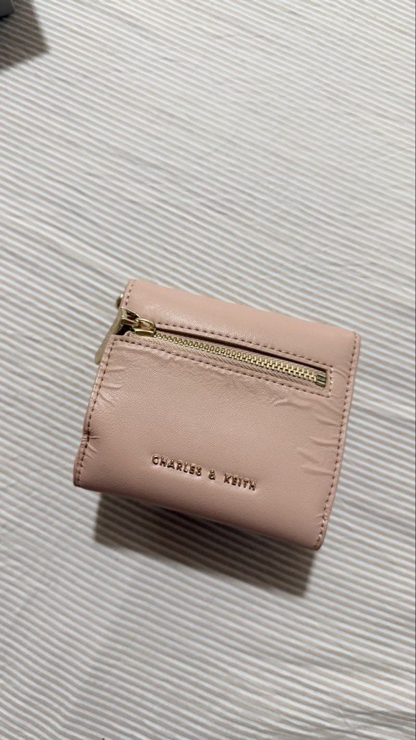 Charles & Keith Pink Tri-fold Wallet with Chain (Category: Wallets & Card holders) located in Manila. Submitted by itsmargauxn (Listing ID 1463154209, Image 3). Description: - with box and dust bag - With a stylish gold chain strap.