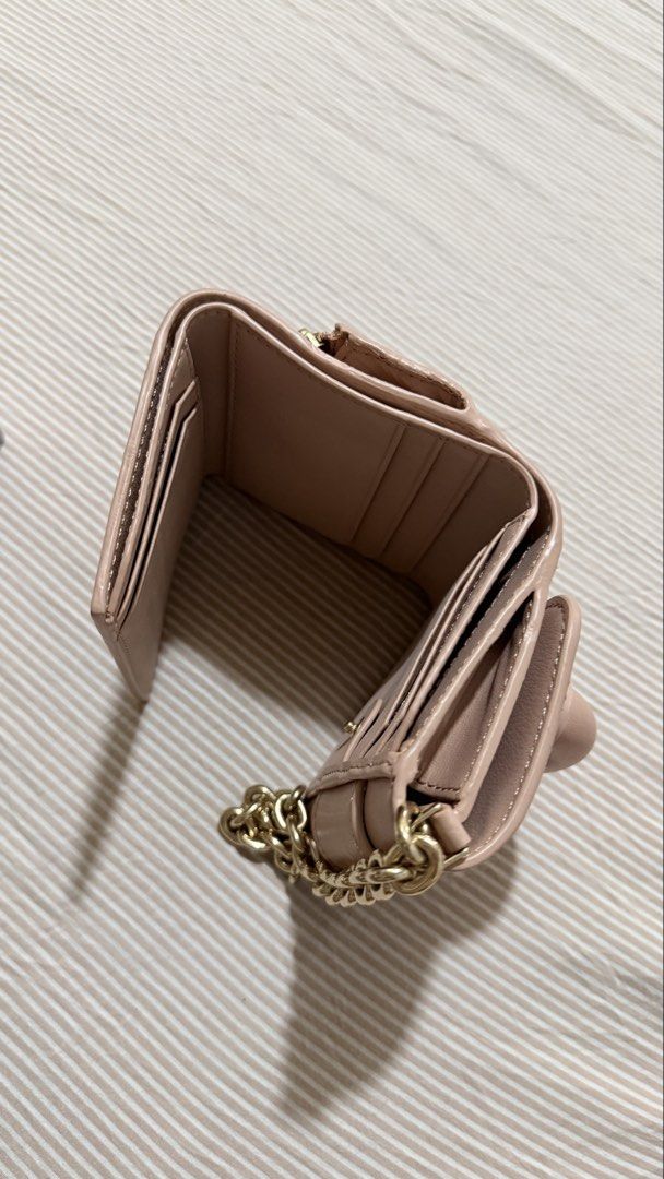 Charles & Keith Pink Tri-fold Wallet with Chain (Category: Wallets & Card holders) located in Manila. Submitted by itsmargauxn (Listing ID 1463154209, Image 2). Description: - with box and dust bag - With a stylish gold chain strap.