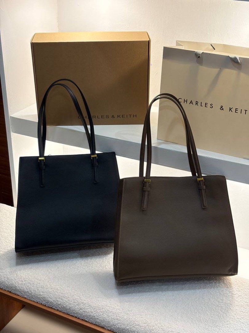Charles & Keith Tote Bag - Black or Brown (Category: Tote Bags) located in Manila. Submitted by cher.ish.ed (Listing ID 1463258330, Image 3). Description: - Charles & Keith Sansa tote bags available: Black, Dark Brown. - Features: Top handles, secure zip closure. - Spacious interior for all your essentials. - Comes with original box and shopping bag. - Ideal for work or everyday carry..
