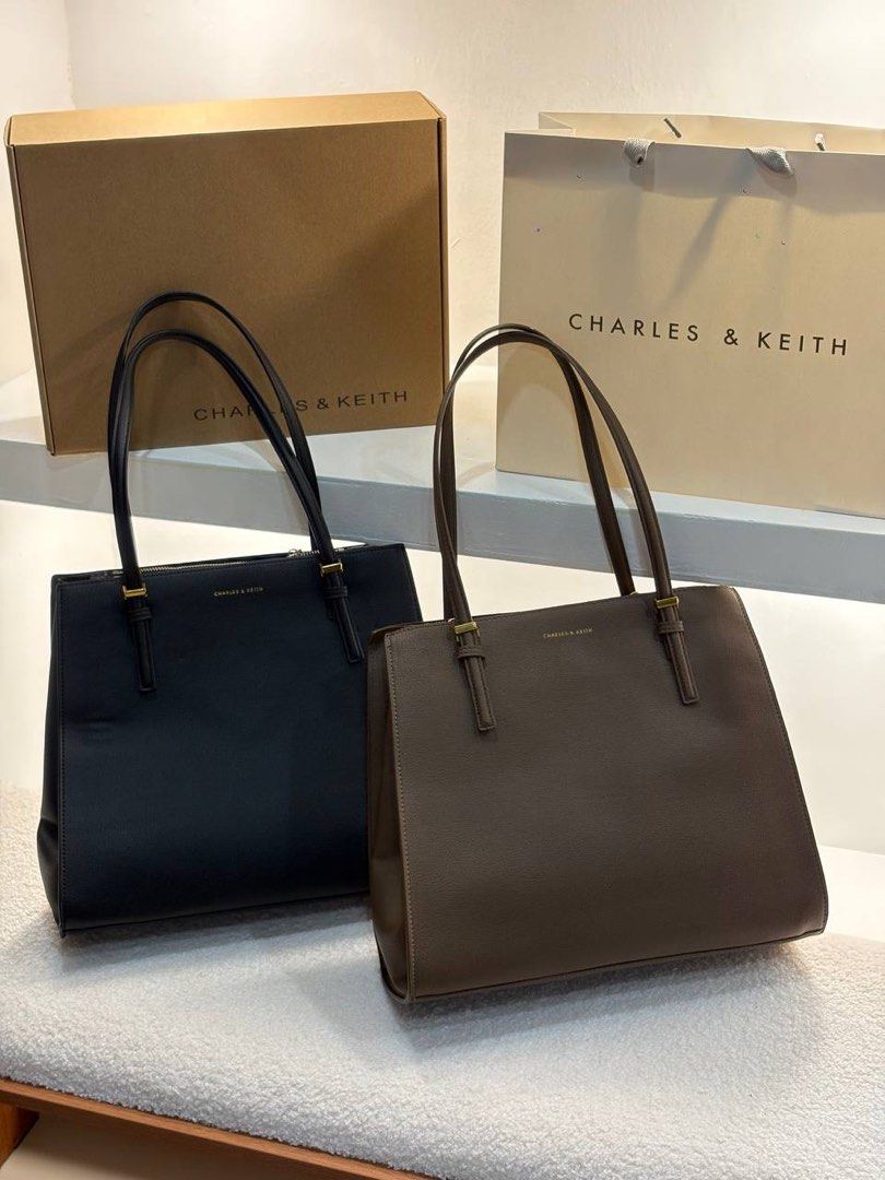 Charles & Keith Tote Bag - Black or Brown (Category: Tote Bags) located in Manila. Submitted by cher.ish.ed (Listing ID 1463258330, Image 2). Description: - Charles & Keith Sansa tote bags available: Black, Dark Brown. - Features: Top handles, secure zip closure. - Spacious interior for all your essentials. - Comes with original box and shopping bag. - Ideal for work or everyday carry..