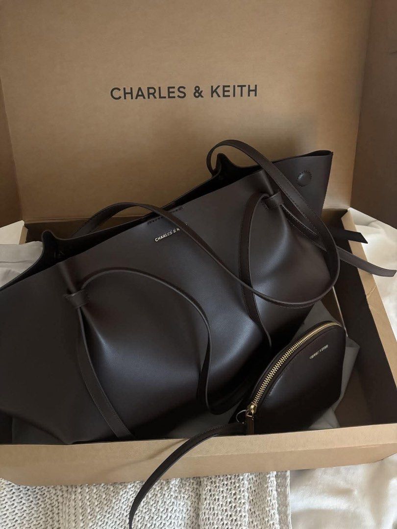 Charles & Keith Tote Bag with Pouch (Category: Tote Bags) located in Manila. Submitted by mellnavarro_45618 (Listing ID 1463142179, Image 1). Description: CNK Calla XL Tote ☁️ Spacious enough to fit a 13–14” laptop! 🥐 Size: 30 × 22–60 × 11.6 cm (H × W × D) 🥐 1,300 + sf.