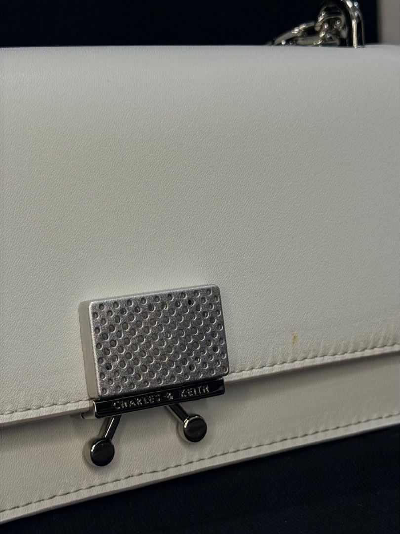 Charles & Keith White Chain Shoulder Bag (Category: Shoulder Bags) located in Caloocan City. Submitted by grandbear.ee4db0 (Listing ID 1463209378, Image 3). Description: CHARLES & KEITH CK6-10840326 ₱2,500 | Negotiable Specifications: • Style: CK6-10840326 • Color: White • Size: XS • Style: Mini Structured Chain Crossbody / Top-Handle Bag • Handle: Braided Top Handle • Strap: Detachable Chain Strap (to be confirmed) • Closure: Push-Lock • Hardwar