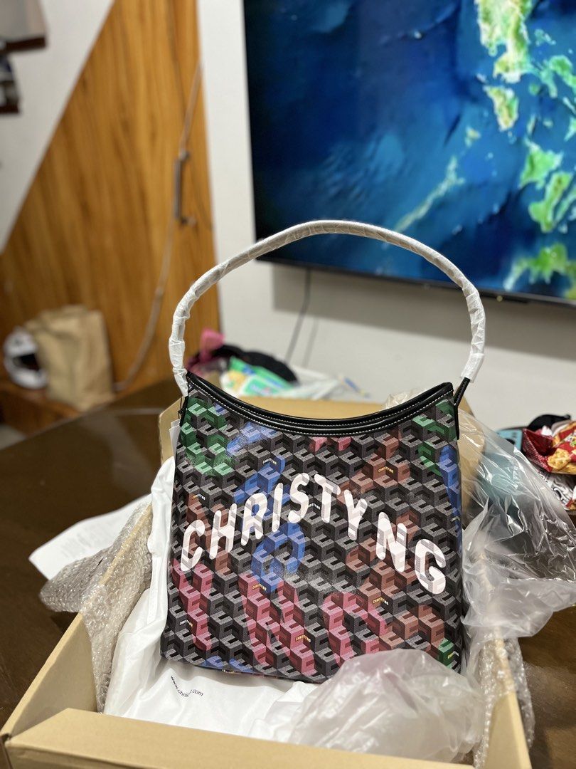 Christy Ng Alessia Large Hobo Bag Multi (Category: Shoulder Bags) located in General Trias. Submitted by mhayeeei (Listing ID 1463252000, Image 1). Description: - Brand: Christy Ng - Model: Alessia Large Hobo Bag - Size: Large (L) - Design: Multi-color pattern with 'CHRISTY NG' text - Purchase Source: christyng.com - Style: Chic and stylish.