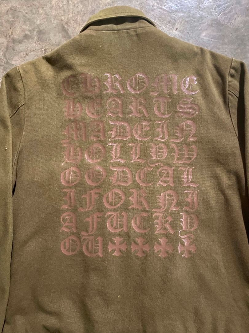 Chrome Hearts Canvass Work Jacket Olive Green (Category: Coats, Jackets and Outerwear) located in Valencia. Submitted by jscurated (Listing ID 1463253263, Image 3). Description: - Olive Green Chrome Hearts Work Jacket - Features iconic Chrome Hearts logo and text graphic on the back - Unique zipper pull and button details for added style - A must-have addition to any Chrome Hearts collection -Canvass Type Jacket.