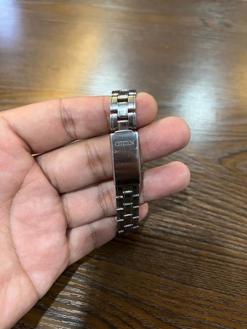Citizen Watch Silver Stainless Steel (Category: Men's Watches) located in Cebu City. Submitted by jbok_watches. (Listing ID 1463262539, Image 3). Description: - Classic Citizen watch - Silver stainless steel band - White dial with Roman numeral hour markers - Day and date display - Clasp features the Citizen logo - Ideal for everyday wear.