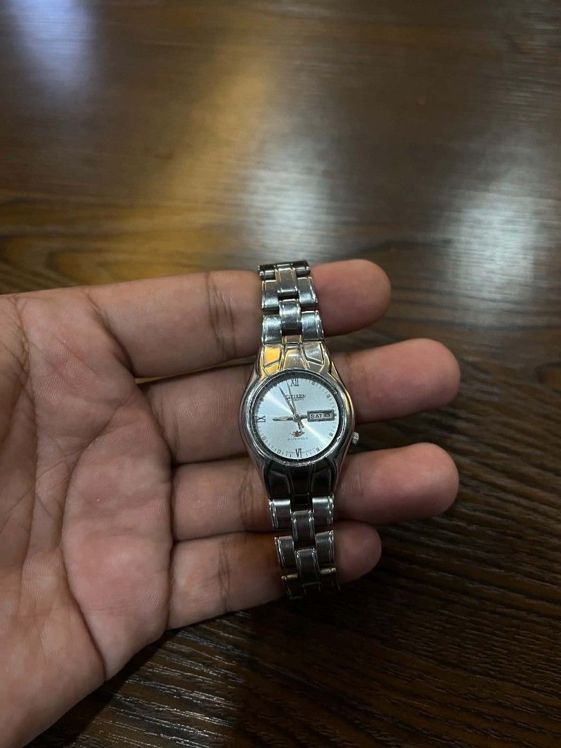Citizen Watch Silver Stainless Steel (Category: Men's Watches) located in Cebu City. Submitted by jbok_watches. (Listing ID 1463262539, Image 2). Description: - Classic Citizen watch - Silver stainless steel band - White dial with Roman numeral hour markers - Day and date display - Clasp features the Citizen logo - Ideal for everyday wear.