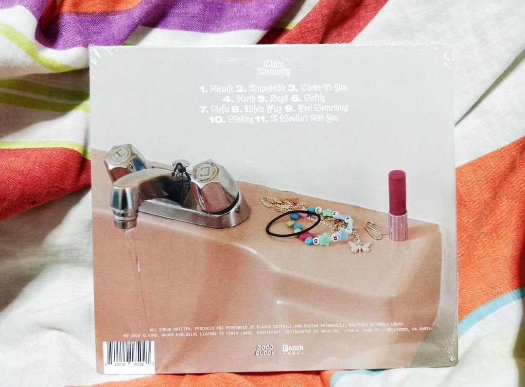 Clairo Immunity CD (Category: CDs & DVDs) located in Santa Rosa. Submitted by kimyalei (Listing ID 1463300632, Image 2). Description: - Brand New: Clairo Immunity CD, still sealed in original plastic wrap. - Iconic Cover Art: Features the recognizable portrait. - Collector's Item: A must-have for any Clairo fan's collection. - RFS: need to buy books:).