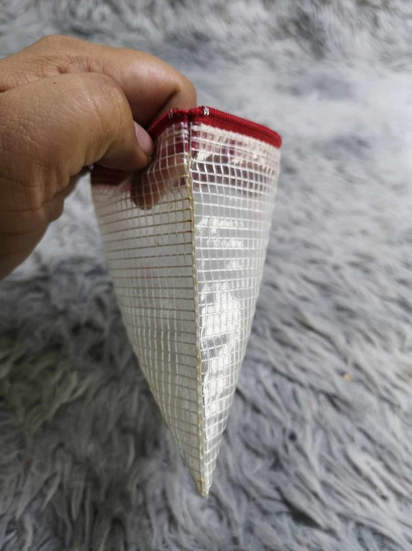 Clear PVC Mesh Zipper Pouch (Category: Stationery & School Supplies) located in Santa Cruz. Submitted by jmy_surplus.2 (Listing ID 1463125247, Image 2). Description: Size ; L - 5 W - 6.6 Color ; Red , White Type ; Pouch Brand ; No brand Material ; PVC Style ; Red Trim Zipper Pouch LR 129 JMY 3 Batch #223.