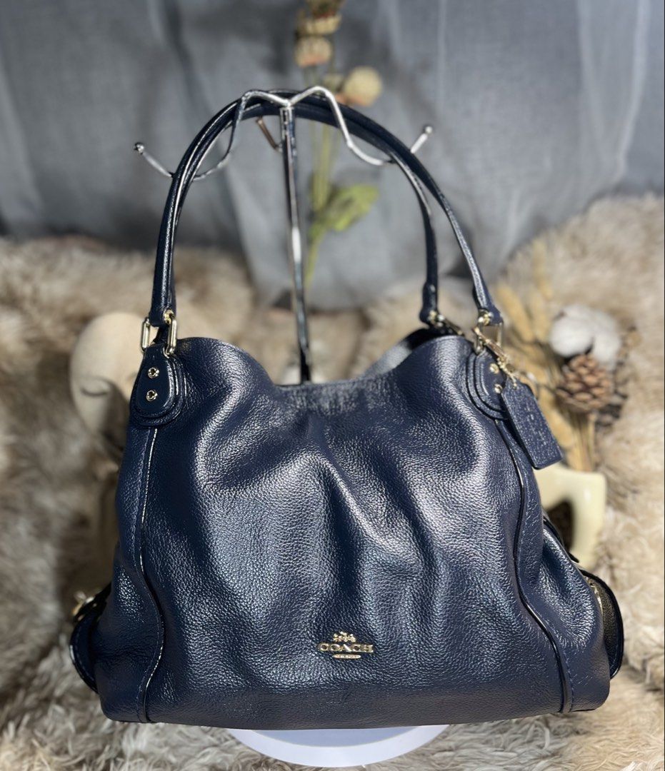 Coach Edie (Category: Shoulder Bags) located in Manila. Submitted by danifortuna (Listing ID 1463244404, Image 1). Description: Og! Honest flaws: bakbak creed, some rubber lining chip/crack but all in all halos bagong bago pa yung bag esp the leather and hardware.