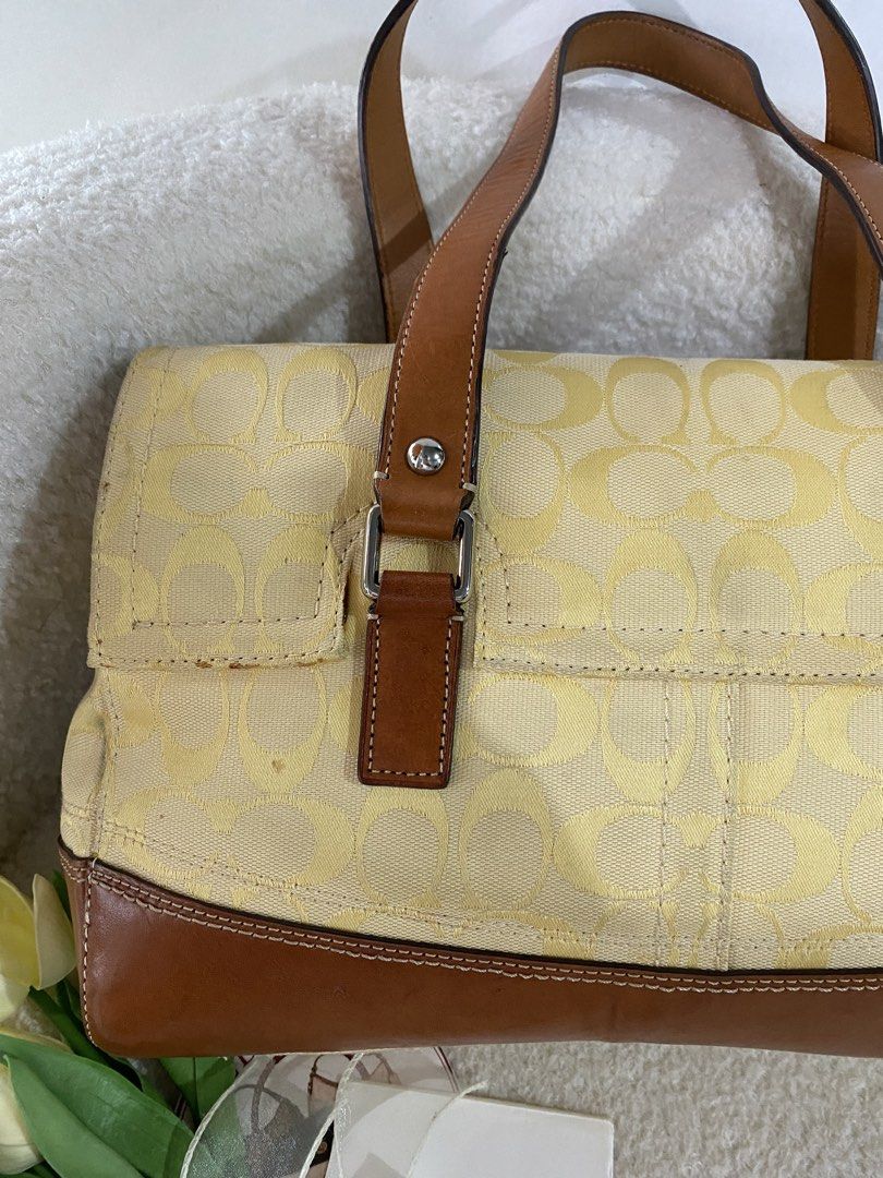 Coach Hampton Yellow Turn-lock Shoulder Bag (Category: Luxury Bags & Wallets) located in Bulacan. Submitted by red.basket24 (Listing ID 1463256439, Image 2). Description: ❣️AVAILABLE❣️CCH Hampton Yellow Turn-lock Shoulder Bag (HTF-Hard to Find) 🏷️Mine: 4,890 php 📌Size:Medium 📌Condition: Lightly Used- Flaws, if any is barely noticeable 🌸YKK Zip 🌸Present Creed and Hangtag 🌸Intact rubber lining 🌸Silver hardwares 🌸No runs/rubs 🌸No peel off/c