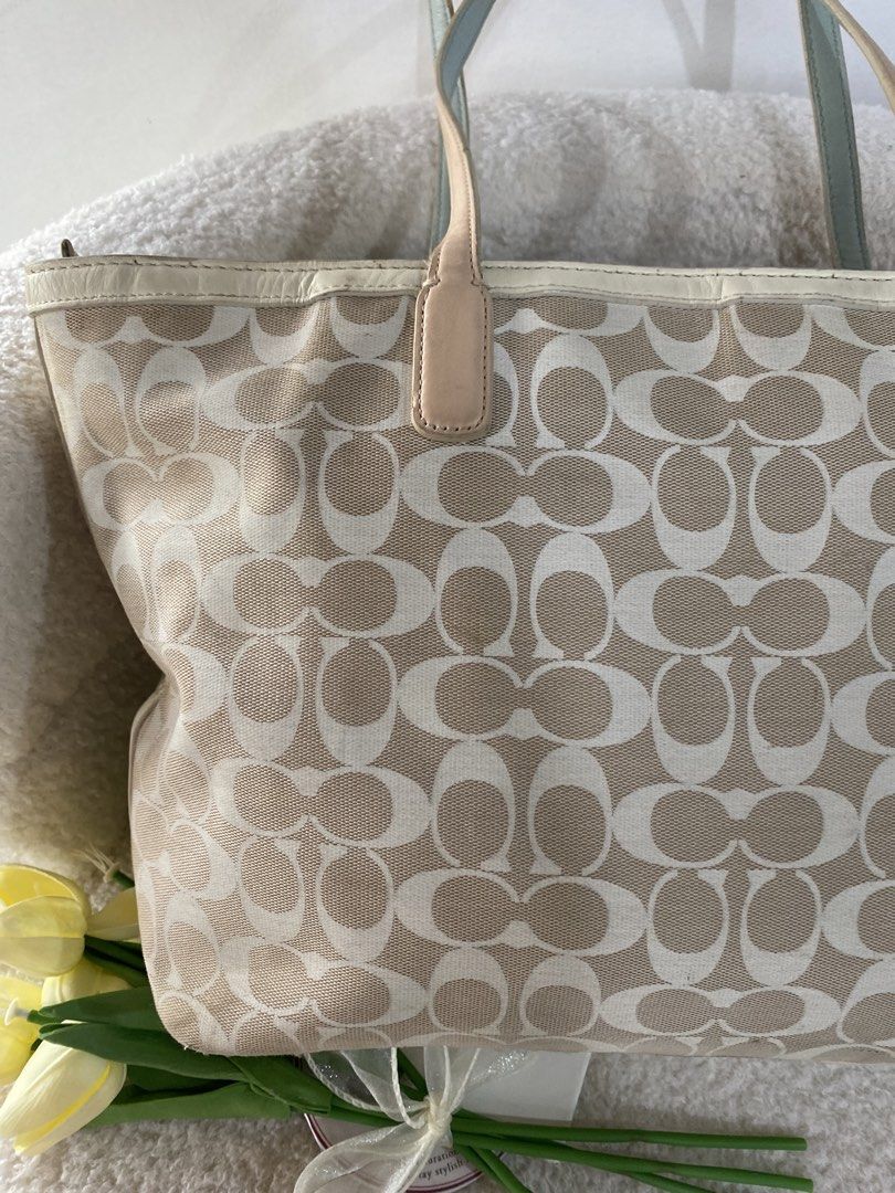 Coach Legacy Weekend Tote Bag (Category: Shoulder Bags) located in Bulacan. Submitted by red.basket24 (Listing ID 1463253518, Image 2). Description: ❣️AVAILABLE❣️CCH Legacy Weekend Tote Bag 🏷️Mine: 2,290 php 📌Size: Medium to Large 📌Condition: Well Used- has visible flaws 🌸YKK Zip 🌸Present Creed and Hangtag 🌸Silver hardwares 🌸No peel off/cracks on leather 🌸Working Zipper Flaw/s: ‼️corners wears, rubs bottom part, signs of wear on rubber li
