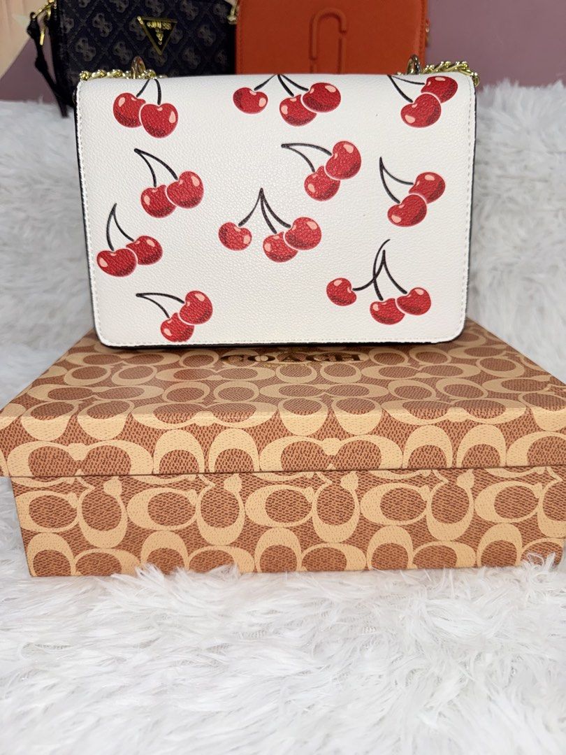 coach mini klare with cherry print (Category: Cross-body Bags) located in Goa. Submitted by zahar_modern_thrift_bags001 (Listing ID 1463182462, Image 2). Description: Brand new with box and all.