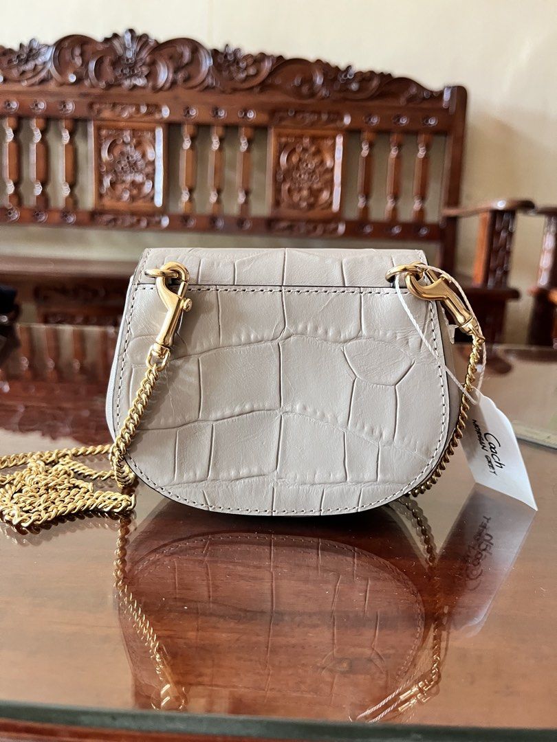Coach Morgan Card Case on Chain in Grey (Category: Luxury Bags & Wallets) located in Dinalupihan. Submitted by penaflorcj (Listing ID 1463142527, Image 2). Description: - Authentic Coach - Croc embossed texture - Elegant gold chain strap - Coach New York logo on buckle - Compact size, ideal for cards and small essentials. - Perfect for evenings out or light travel. - Approximately 4 inches wide. - Can send a video rfs: decluttering *price is nego